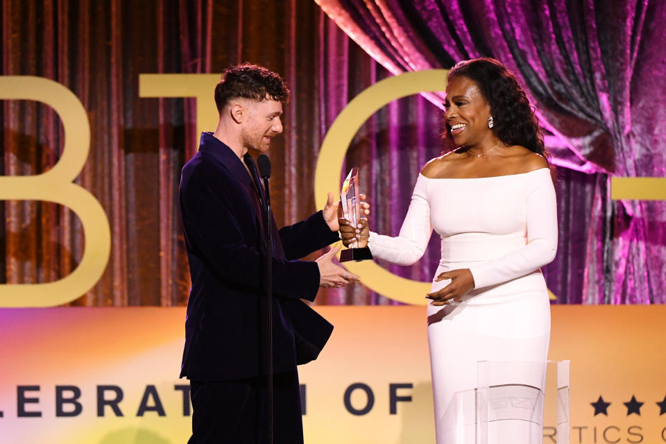 Chris Perfetti accepts the Breakthrough Performance Award from Sheryl Lee Ralph (Photo by Jon Kopaloff/Getty Images for Critics Choice Association)