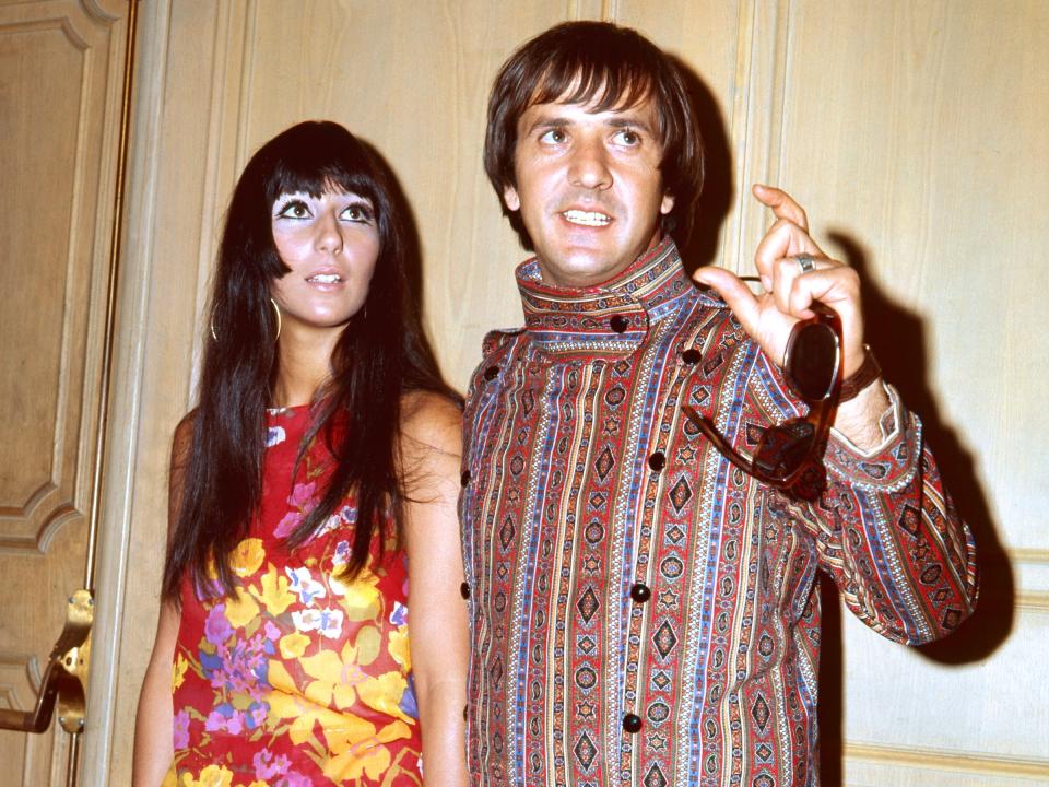 Sonny and Cher posing together.
