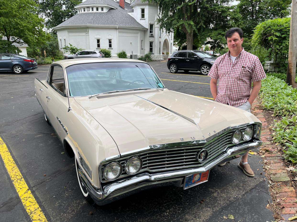 Michael Francioni of Long Island, N.Y., poses with his 1964 Buick Electra 225 at the Reeves Victorian Home and Carriage House Museum in Dover. The car's previous owner was Loretta Eleanor Deis of Dover.