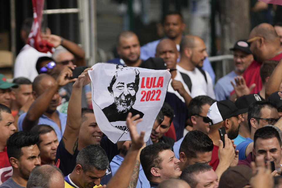 Supporters of Brazil's former President Luiz Inacio Lula da Silva, who is running for reelection, cheer during a campaign rally outside the Volkswagen automaker´s plant in Sao Bernardo do Campo, greater Sao Paulo area, Brazil, Tuesday, Aug. 16, 2022. Brazil's general elections are scheduled for Oct. 2, 2022. (AP Photo/Andre Penner)