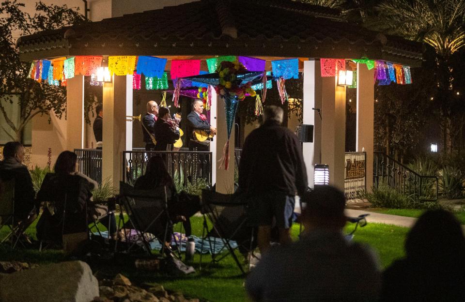 Residents gather around to listen to the first Mariachi Tuesday performance at the Coachella Library gazebo, Tuesday, Nov. 23, 2021, in Coachella, Calif. 