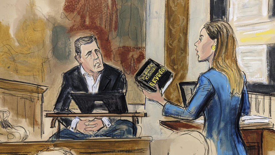 In this courtroom sketch, Michael Cohen testifies on witness stand, under cross examination by Donald Trump's attorney Alina Habba, right, as she holds Cohen's book "Revenge," during Trump's civil business fraud trial, in New York Supreme Court, Wednesday, Oct. 25, 2023, in New York. (Elizabeth Williams via AP)