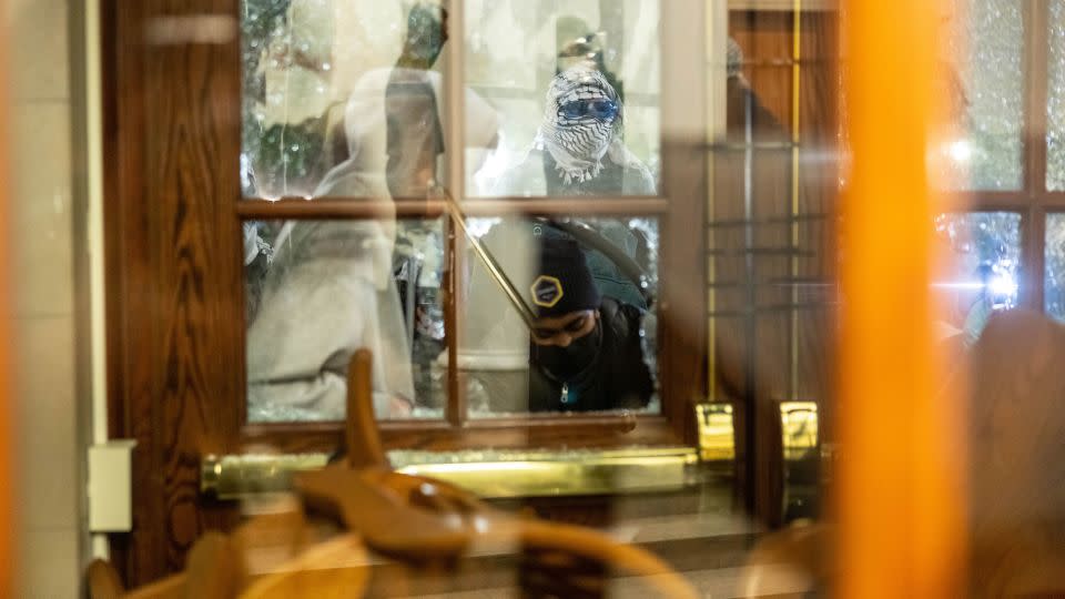 Demonstrators supporting Palestinians in Gaza barricade themselves inside Hamilton Hall at Columbia University in New York City on April 30. - Alex Kent/Getty Images