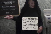 <p>A man dressed as the grim reaper waits in line for a US Senate Committee on Finance hearing on the Graham-Cassidy-Heller-Johnson Proposal on reforming health care on Capitol Hill in Washington, DC, September 25, 2017. (Photo: Saul Loeb/AFP/Getty Images) </p>