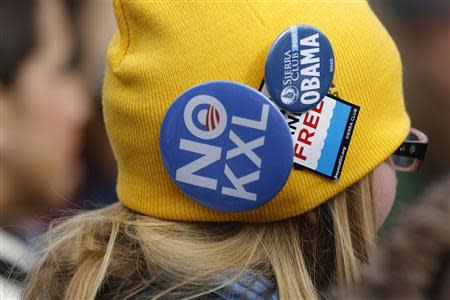 Environmental activists opposed to the Keystone XL tar sands pipeline project protest outside the White House in Washington, February 13, 2013. REUTERS/Jonathan Ernst