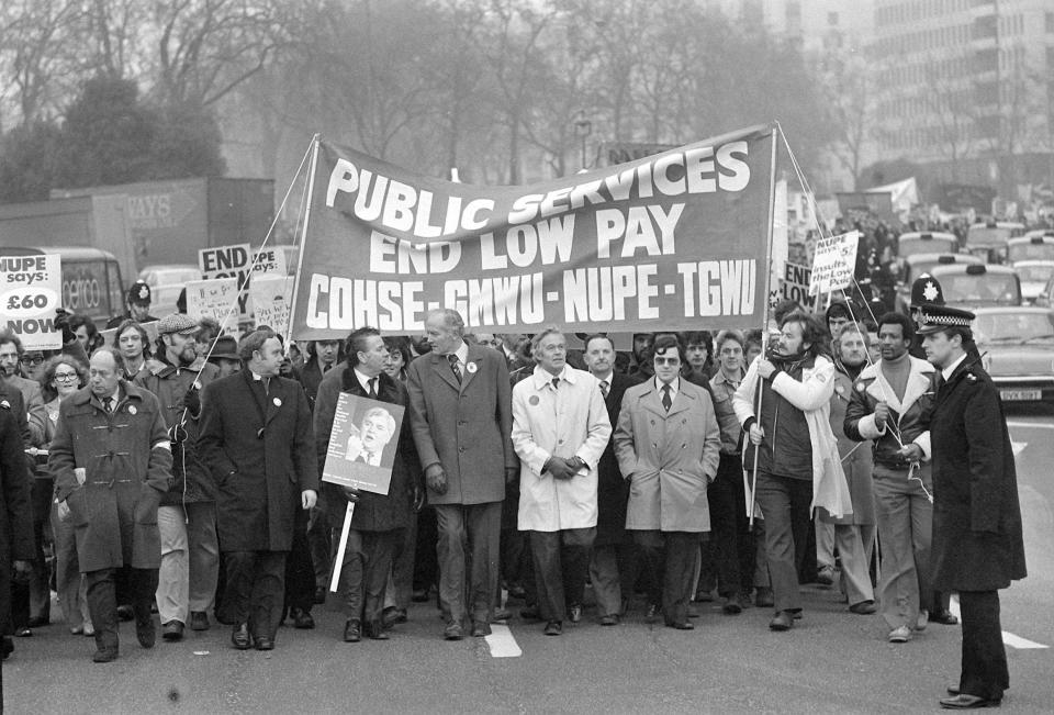 Mr Alan Fisher (white mac), general secretart of NUPE, and Mr David Basnett (centre, tallest), general secretary of the General and Municipal Workers' Union, at the head of a mass march to Parliament where public services workers planned to lobby MPs as part of a 