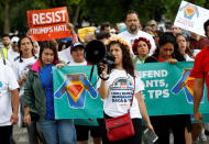 <p>Demonstrators carrying signs march during a rally by immigration activists CASA and United We Dream demanding the Trump administration protect the Deferred Action for Childhood Arrivals (DACA) program and the Temporary Protection Status (TPS) programs, in Washington, D.C., Aug. 15, 2017. (Photo: Joshua Roberts/Reuters) </p>