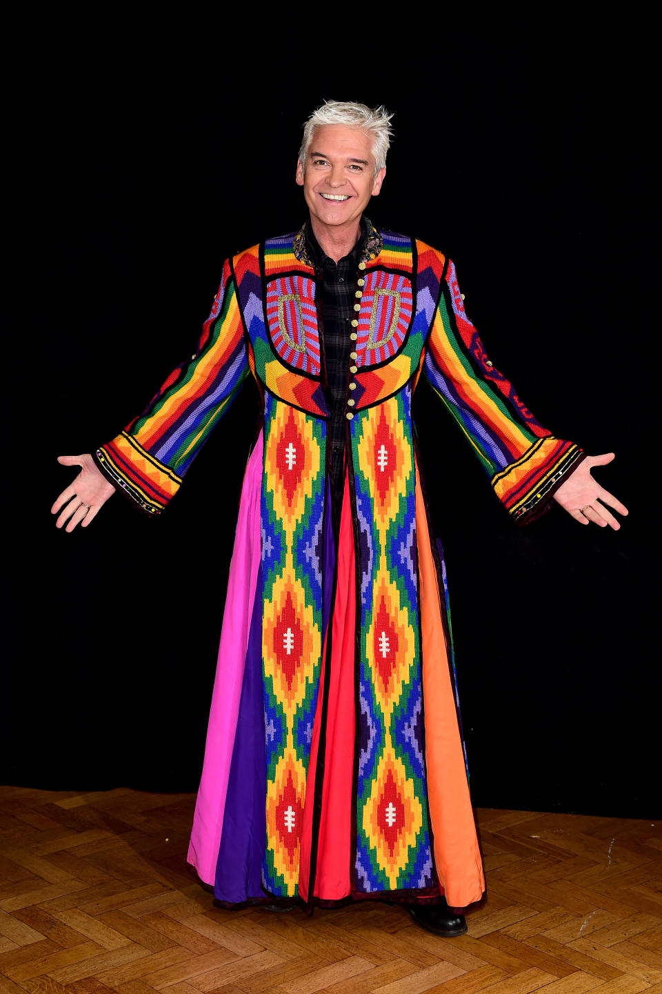 Embargoed to 0001 Wednesday April 20 Phillip Schofield models his old technicolour dreamcoat at the Music Rooms in New Cross Gate, London, as he prepares to revive the role for a special short run tour.