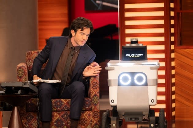 Host John Mulaney and the delivery robot Saymo in a moment from Mulaney's live Netflix talk show 'Everybody's in L.A.' - Credit: Adam Rose/Netflix