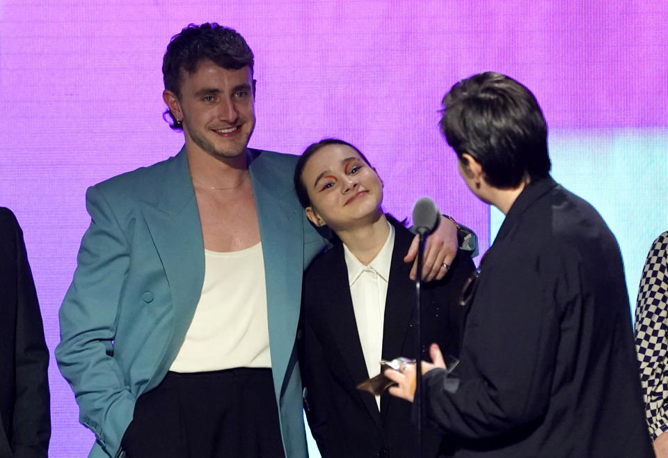 Director Charlotte Wells, from right, speaks to actors Paul Mescal and Frankie Corio as they accept the award for best first feature for "Aftersun" at the Film Independent Spirit Awards on Saturday, March 4, 2023, in Santa Monica, Calif. (AP Photo/Chris Pizzello)