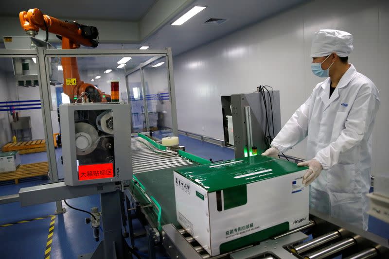 An employee works at a packaging line at Ringpu Biotech in Tianjin