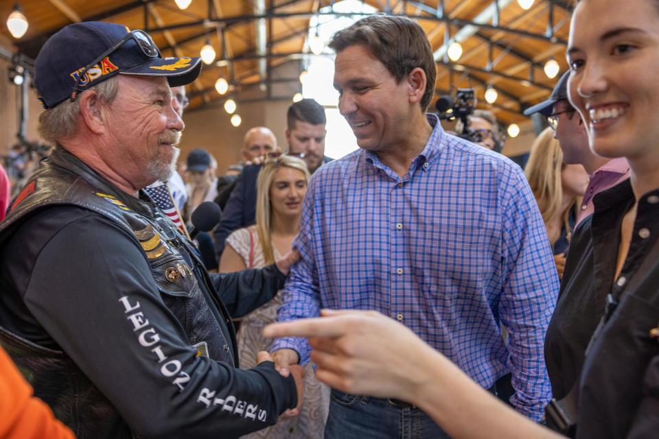 Florida Gov. Ron DeSantis greets attendees during the annual Roast and Ride hosted by Sen. Joni Ernst in Des Moines on June 3, 2023.  / Credit: Rachel Mummey/Bloomberg via Getty Images