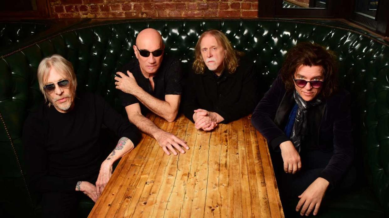  Gov't Mule sitting at a table 