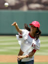 Eva Longoria throws out the first pitch at the New York Yankees Los Angeles Angels game in Anaheim Calif., on Sunday, July 24, 2005. Longoria is an actress who currently stars in the television show "Desperate Housewives". (AP Photo/Chris Carlson)