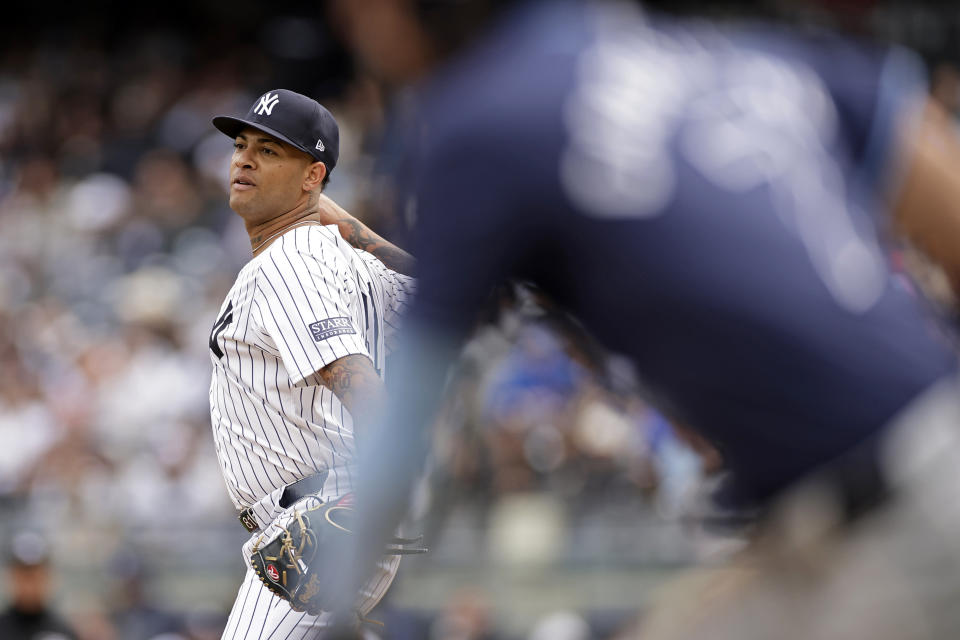 New York Yankees pitcher Luis Gil is called for a balk against Tampa Bay Rays' José Caballero during the third inning of a baseball game Sunday, April 21, 2024, in New York. (AP Photo/Adam Hunger)