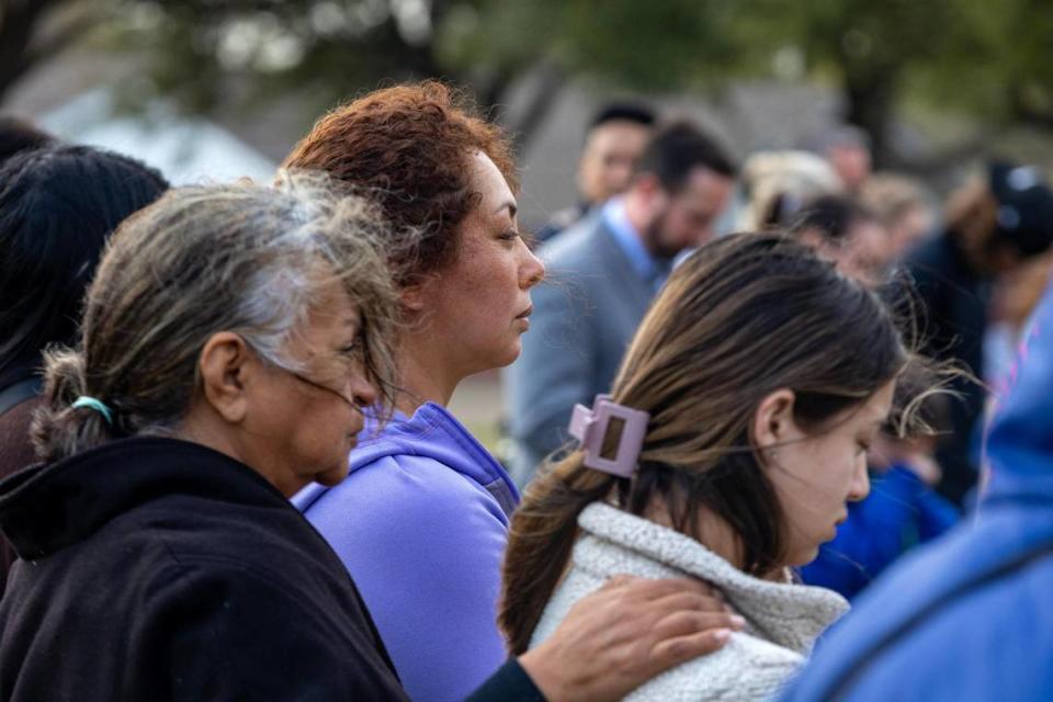 Alina Nieves, Josey Magana and Lamar High student Alina Moguel, 15, attend a vigil for Ja’Shawn James Poirier on Tuesday, March 21, 2023, in Arlington. Poirier, 16, was fatally shot at Lamar High on Monday.