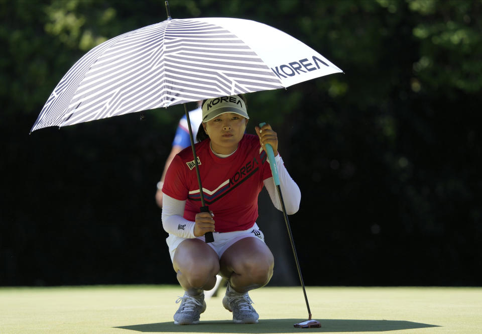 Jin Young Ko, of South Korea, lines up a putt on the 18th hole during the first round of the women's golf event at the 2020 Summer Olympics, Wednesday, Aug. 4, 2021, at the Kasumigaseki Country Club in Kawagoe, Japan. (AP Photo/Andy Wong)