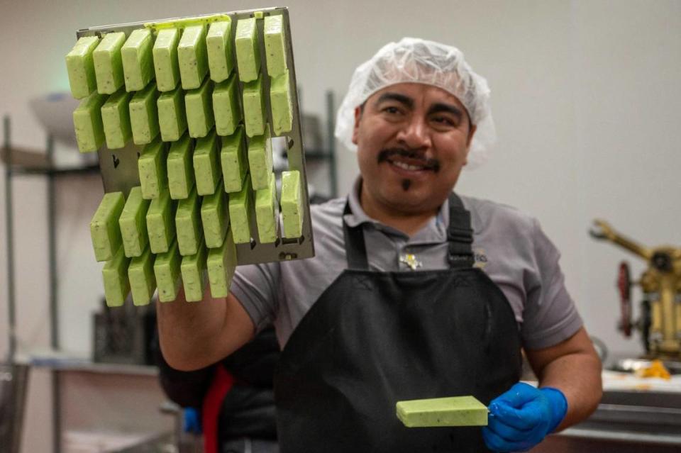 Hugo Márquez shows off the pistachio paletas he made using a mold at the Palacana factory in Roeland Park.