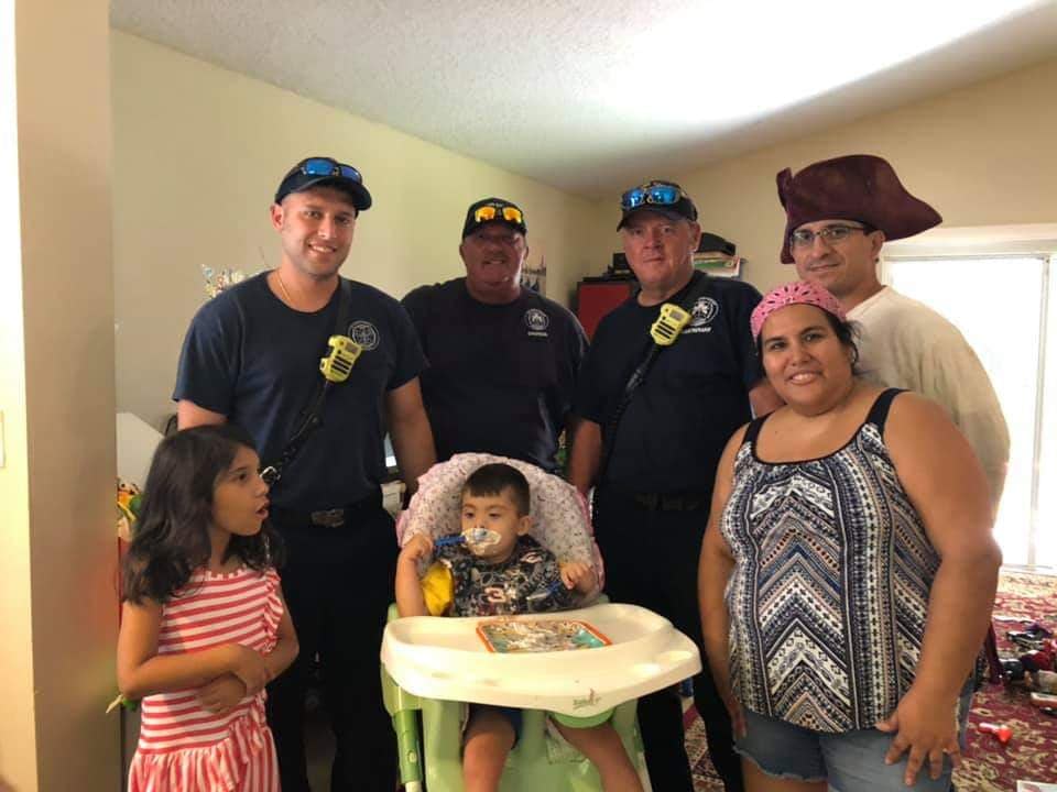 A few firefighters joined in on the birthday party for Shemy. (Photo courtesy of Susan Casado)