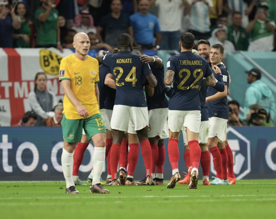 France players celebrate after a goal against Australia in the FIFA World Cup.