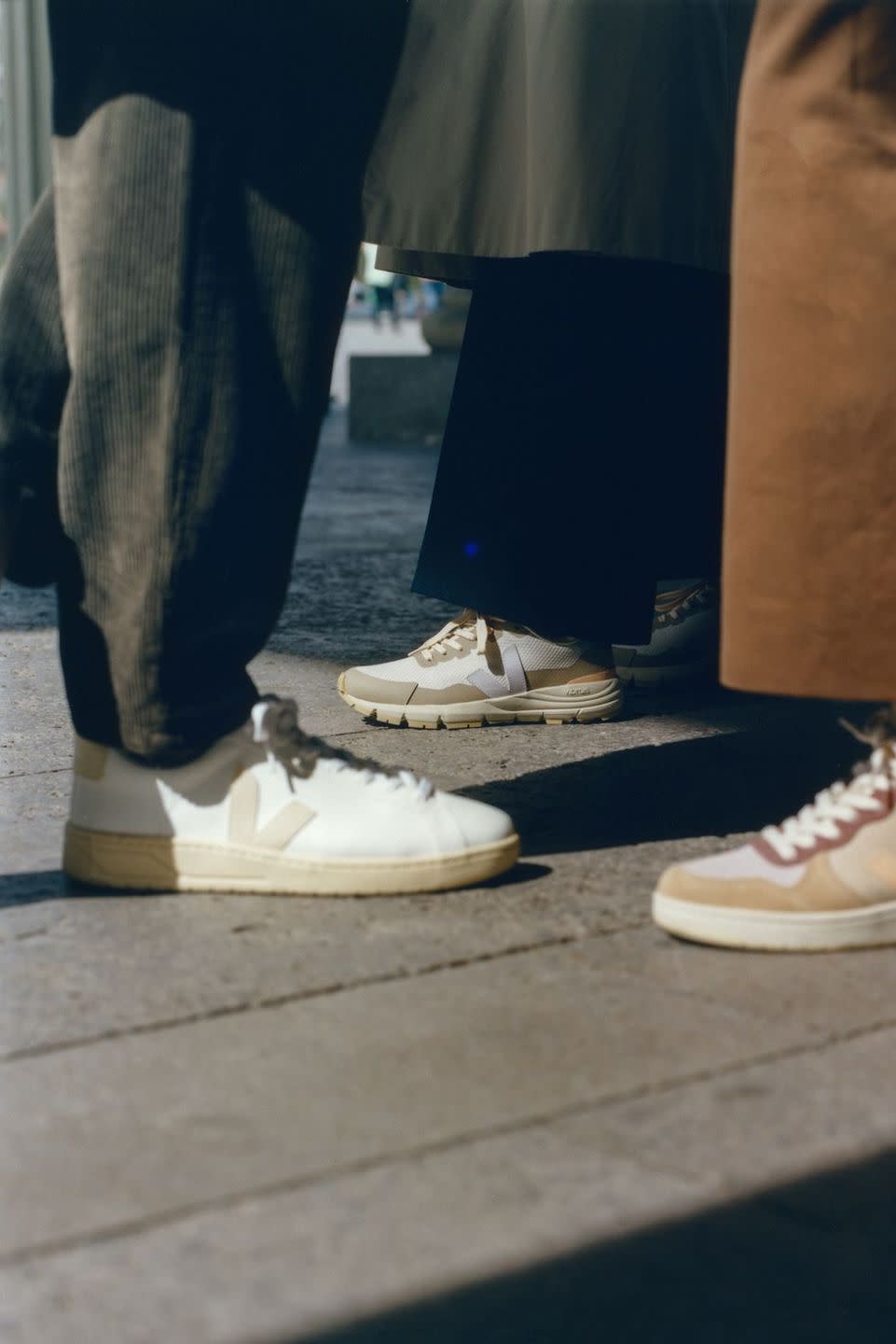 a pair of legs wearing white shoes