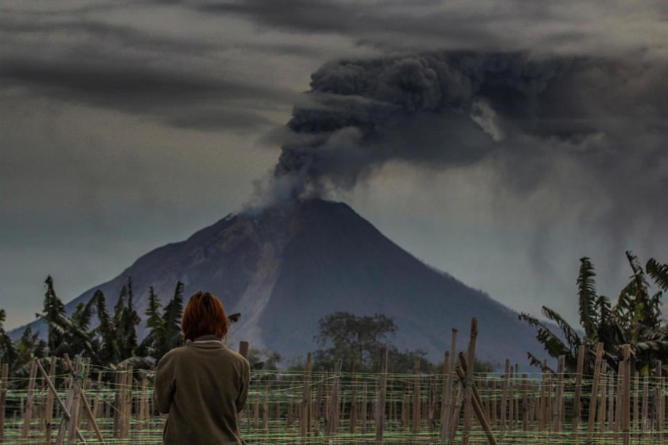 Mount Sinabung spews volcanic ash into the air