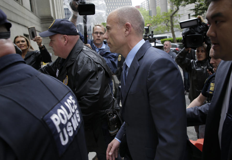 Attorney Michael Avenatti, center, enters a courthouse in New York, Tuesday, May 28, 2019, for a hearing where he pleaded not guilty to charges that he defrauded his most famous client, porn star Stormy Daniels. (AP Photo/Seth Wenig)