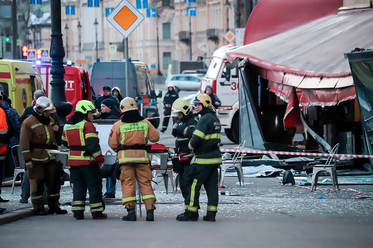 Russian Emergency Situations Ministry stand at the side of an explosion at a cafe in St. Petersburg, Russia (AP)