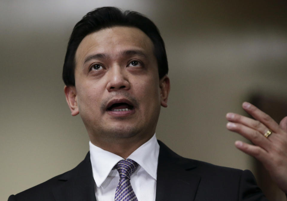 Philippine opposition Sen. Antonio Trillanes IV gestures as he talks to the media outside his office where he remains holed up in the Philippine Senate in suburban Pasay city, south of Manila, Philippines on Tuesday, Sept. 11, 2018. Trillanes has been staying inside his senate office for over a week to avoid an arrest order by Philippine President Rodrigo Duterte. (AP Photo/Aaron Favila)