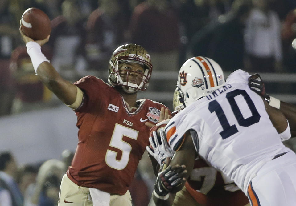 Florida State's Jameis Winston (5) throws during the first half of the NCAA BCS National Championship college football game against Auburn Monday, Jan. 6, 2014, in Pasadena, Calif. (AP Photo/David J. Phillip)