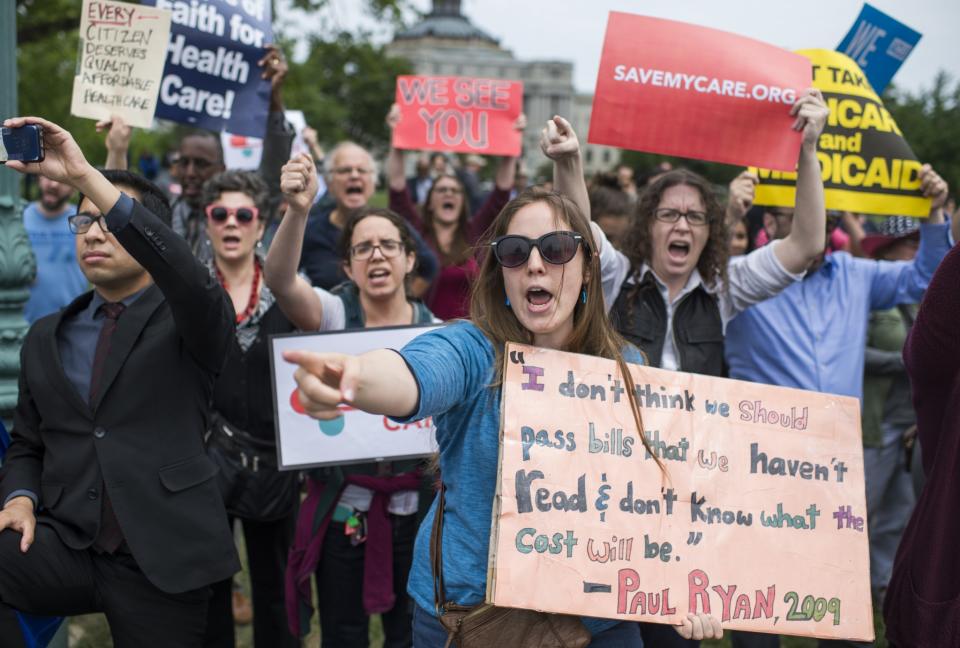 Protesters yell “shame'” to members of Congress on the East Front of the Capitol after the House passed the Republicans’ bill to repeal and replace the Affordable Care Act on May 4, 2017. (Photo: Tom Williams/CQ Roll Call/Getty Images)