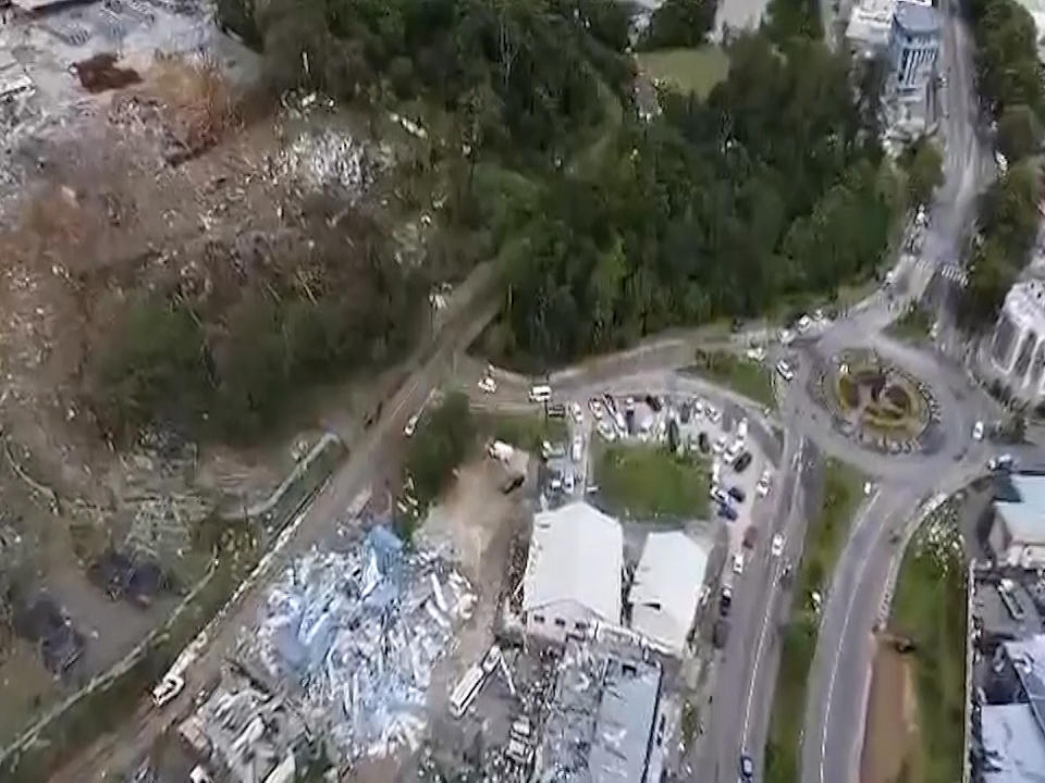 In this image made from video, Buildings damaged after a massive explosion at an industrial area on the main island in Mahe, Seychelles, Thursday, Dec. 7, 2023. The president of Seychelles declared a state of emergency on Thursday after a huge blast at an explosives depot and flooding in other parts of the country's main island. (AP Photo/Emilie Chetty)