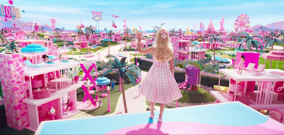 Margot Robbie as Barbie overlooking Barbie Land