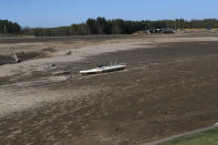 View of Wixom Lake, Thursday, May 21, 2020, after the water was drained after the Edenville Dam failed and flood waters rushed south, ravaging the landscape in its path, in Edenville Township, Mich. (AP Photo/Carlos Osorio)