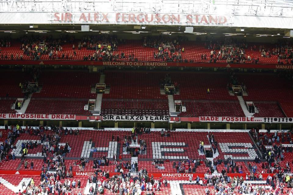 Sections of Old Trafford stadium are evacuated before the Barclays Premier League match between Manchester United and AFC Bournemouth in Manchester, England, on May 15, 2016. (Andrew Yates/Livepic/Reuters)
