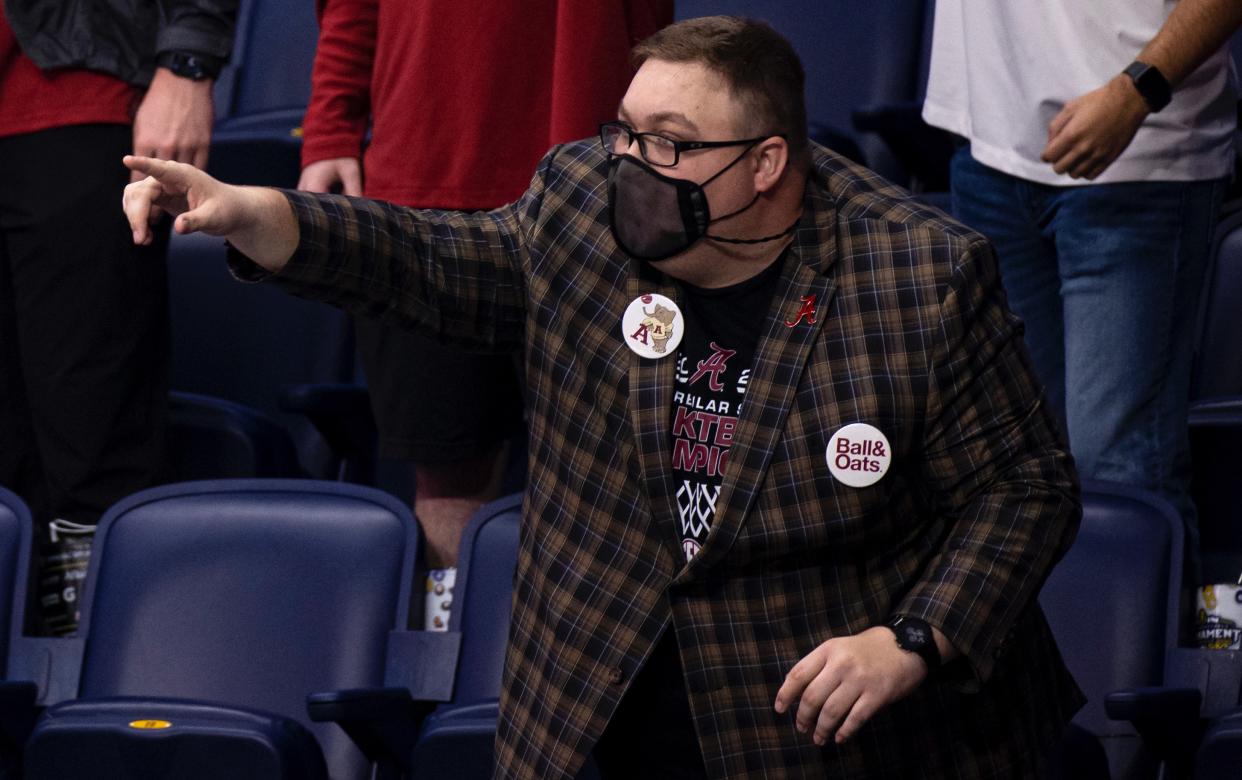 NASHVILLE, TN - MARCH 12:  Alabama Crimson fans cheer against the Mississippi State Bulldogs during the second half of their quarterfinal game in the SEC Men's Basketball Tournament at Bridgestone Arena on March 12, 2021 in Nashville, Tennessee. Alabama defeats Mississippi State 85-48. (Photo by Brett Carlsen/Getty Images)