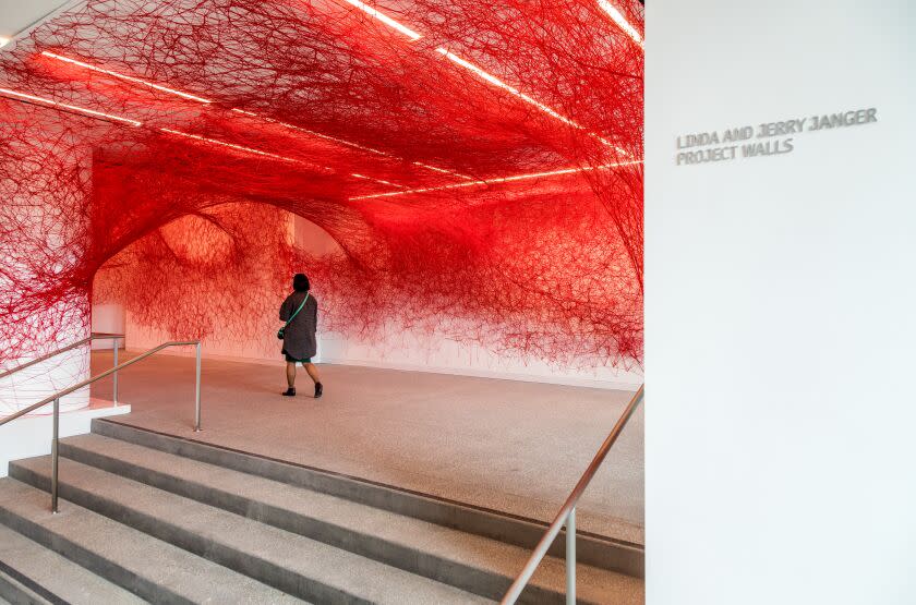 LOS ANGELES, CA - MARCH 23, 2023 - Artist Chiharu Shiota installation, The Network, made with red yarn is on display. In the new lobby are at the Hammer Museum, March 23, Los Angeles, CA . (Ricardo DeAratanha / Los Angeles Times)