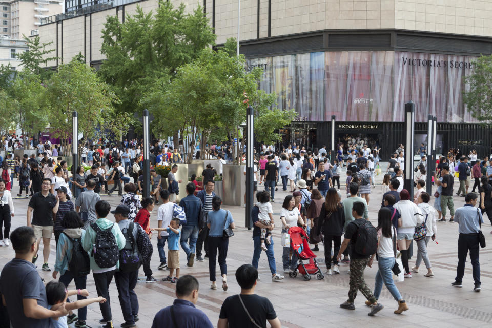 Large crowd of people in Wangfujing street, the most famous shopping street in Beijing, on Sept. 13, 2019: . With close to 300 shops and malls it is a popular place for locals and visitors from around the world. Shops range from high end designers to every-day consumer stores. Credit: Getty Images