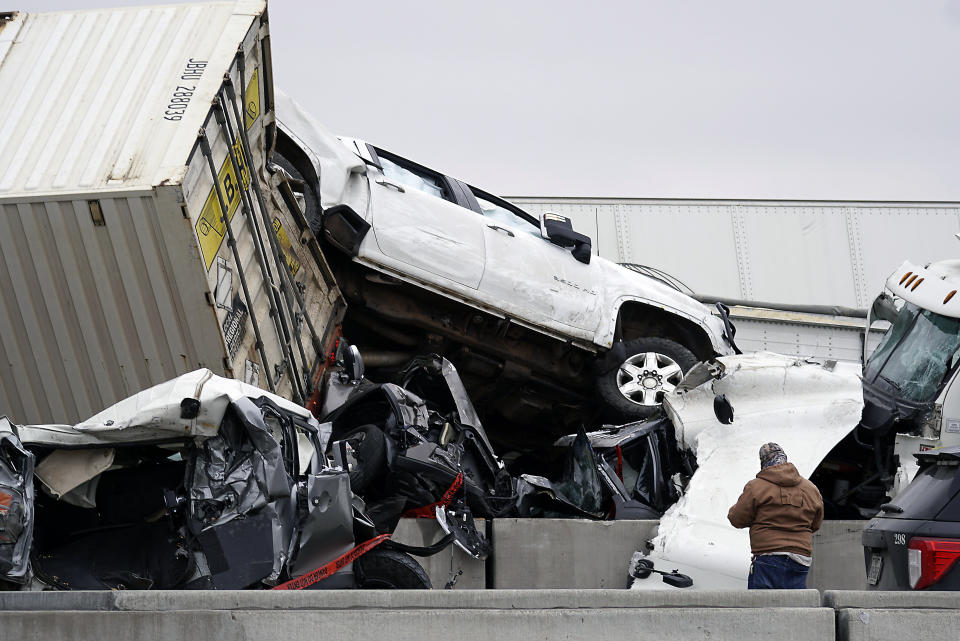 FILE - Vehicles are piled up after a fatal crash on Interstate 35 near Fort Worth, Texas on Thursday, Feb. 11, 2021. The National Transportation Safety Board said Tuesday, Feb. 16, 2021 that it will investigate a massive crash last week involving over 130 vehicles on an icy Texas highway that left six people dead and dozens injured. (Lawrence Jenkins/The Dallas Morning News via AP, file)