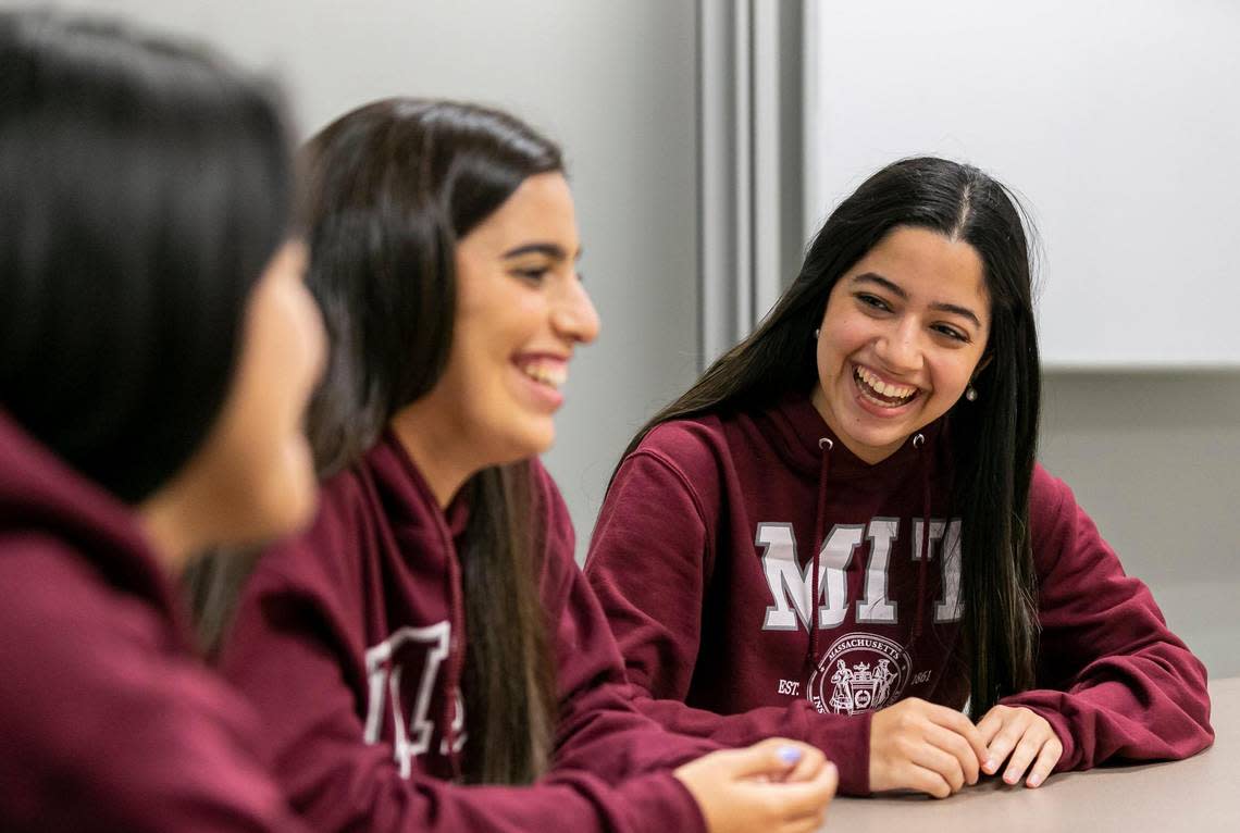 From left to right: Romina Cano Velasquez, 24, Fabiana Gonzalez Zambrano, 20, and Ana Camba Gomes, 20, talk between themselves while visiting the Miami Dade College West Campus on Friday, Aug. 19, 2022, in Doral, Fla. All three, MDC Honors College students, have been accepted into the Massachusetts Institute of Technology.