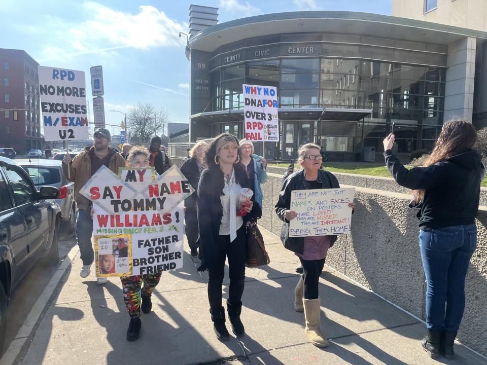 The group of about ten people, consisting of community members and families of local missing people, began their protest outside of the Public Safety Building.