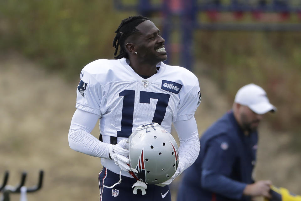 New England Patriots wide receiver Antonio Brown carries his helmet during an NFL football practice, Wednesday, Sept. 18, 2019, in Foxborough, Mass. (AP Photo/Steven Senne)