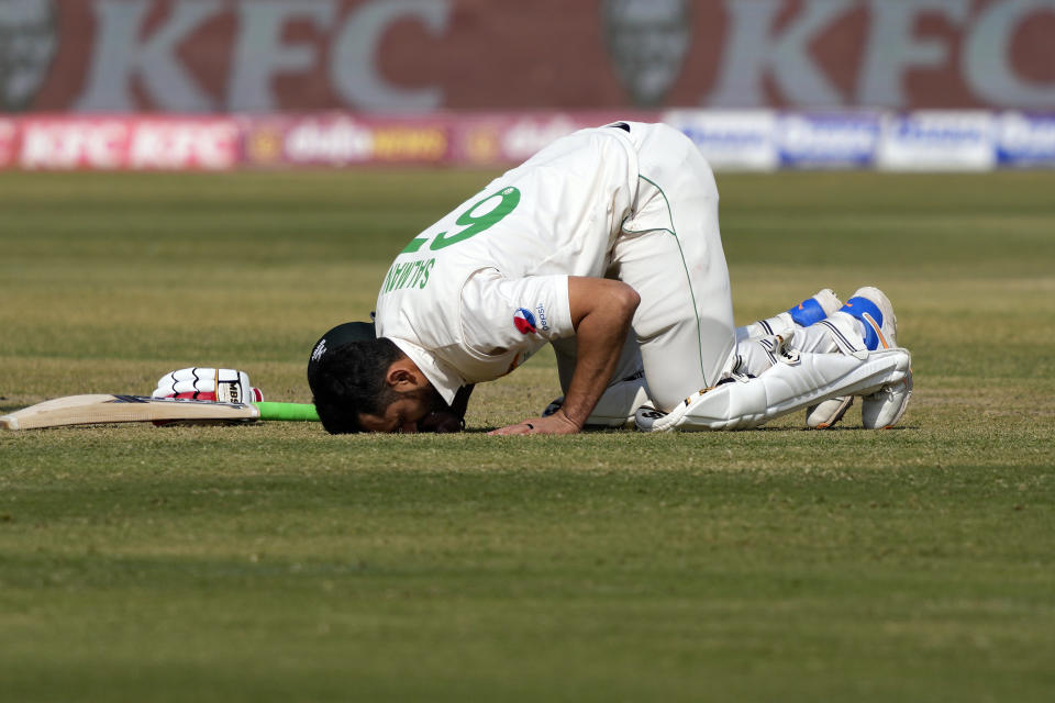 Pakistan's Agha Salman performs Sajdah, a prayer bow in gratitude to God, after scoring century during the second day of first test cricket match between Pakistan and New Zealand, in Karachi, Pakistan, Tuesday, Dec. 27, 2022. (AP Photo/Fareed Khan)