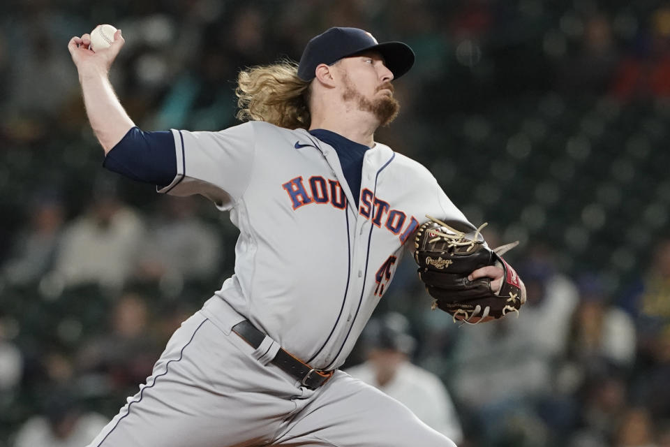 Houston Astros relief pitcher Ryne Stanek throws against the Seattle Mariners during the eighth inning of a baseball game, Monday, Aug. 30, 2021, in Seattle. (AP Photo/Ted S. Warren)