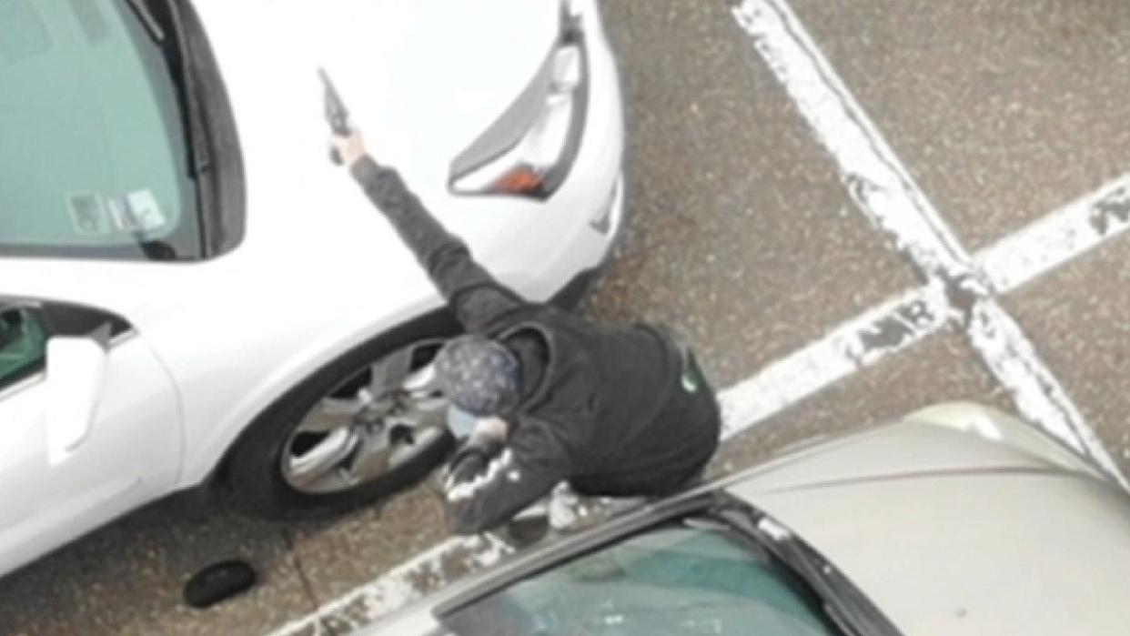 <div>A photo from police shows an armed Roche in the Woodbury Target parking lot.</div> <strong>(Woodbury Police Department / Supplied)</strong>