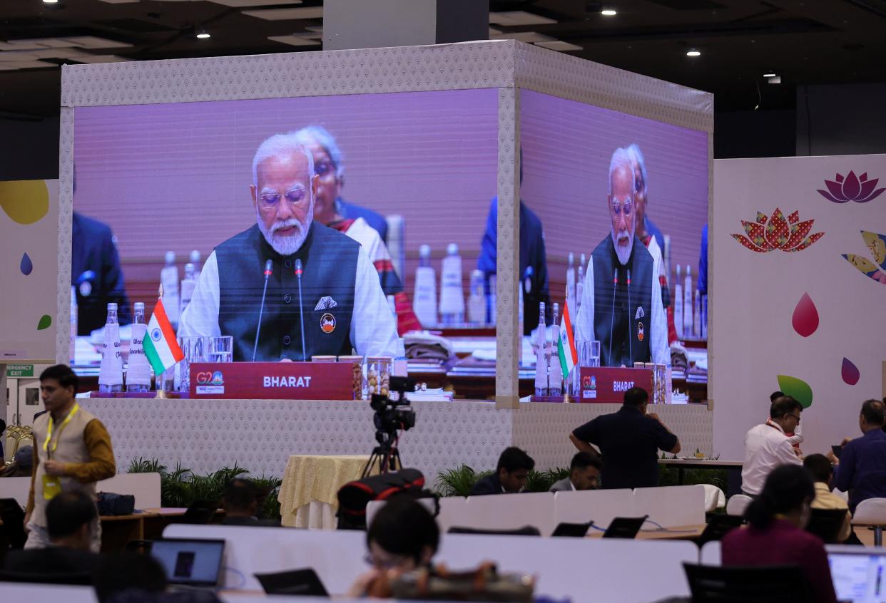 A giant screen displays India’s Prime Minister Narendra Modi with the label ‘Bharat' (REUTERS)