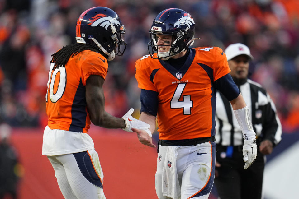 Denver Broncos quarterback Brett Rypien (4) celebrates with wide receiver Jerry Jeudy (10) during the second half of an NFL football game against the Arizona Cardinals, Sunday, Dec. 18, 2022, in Denver. (AP Photo/Jack Dempsey)