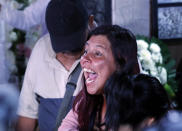 Maria Magdalena Anton, mother of Fatima, a 7-year-old girl who was abducted from the entrance of the Enrique C. Rebsamen primary school and later killed, screams "Justice" during the girl's wake at thier home in Mexico City, Monday, Feb. 17, 2020. Fatima's body was found wrapped in a bag and abandoned in a rural area on Saturday and was identified by genetic testing. (AP Photo/Marco Ugarte)