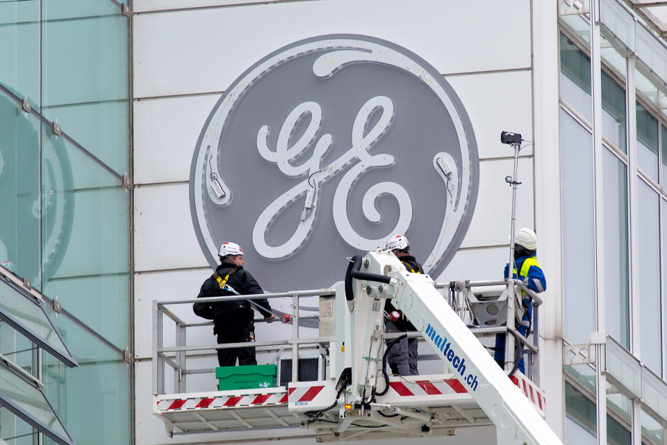 Baden, Switzerland. November 2, 2015: Lighting tests during the installation of the new General Electric logo at the former Alstom thermal power headquarters.