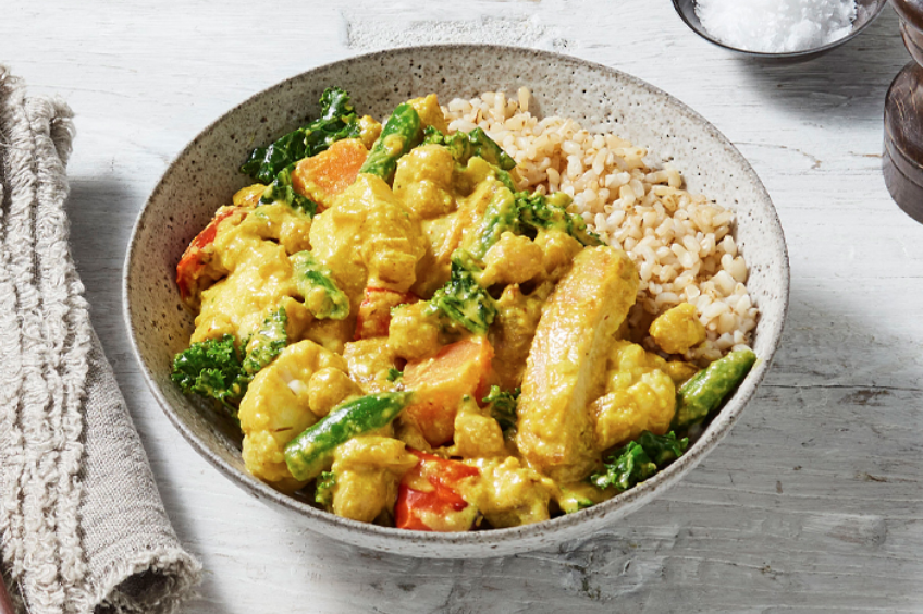 bowl of chicken massaman curry with brown rice